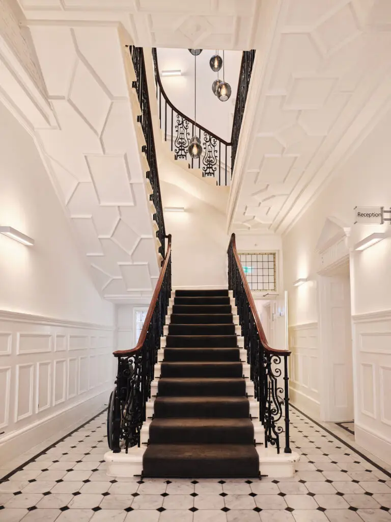 Elegant staircase interior at lumen harley street clinic - health assessment london